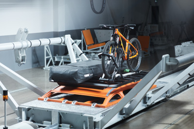 Thule Upride back rack besides a Roof tent