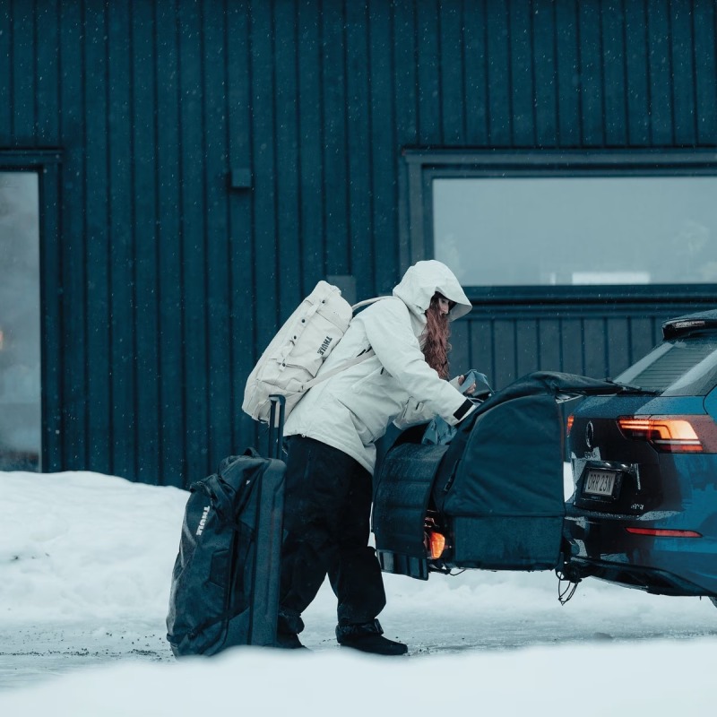 Thule Onto 2 storage box open on vehicle with bags