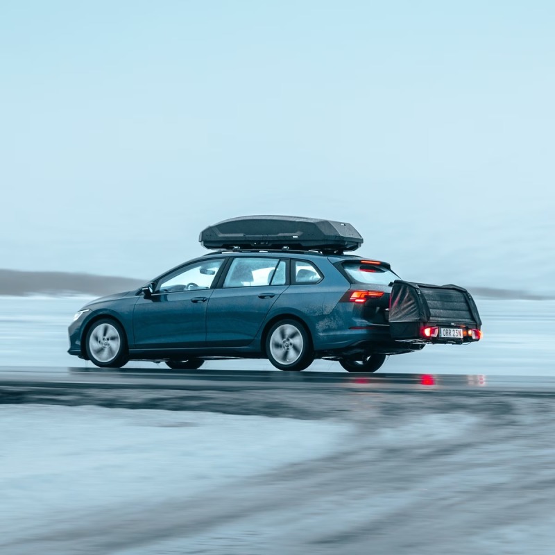 Thule Onto 2 storage box closed moving on car towbar with lights on