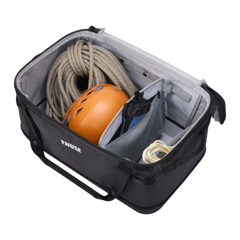 Thule Chasm Gear Hauler 55L Black Open with stuff inside with divider