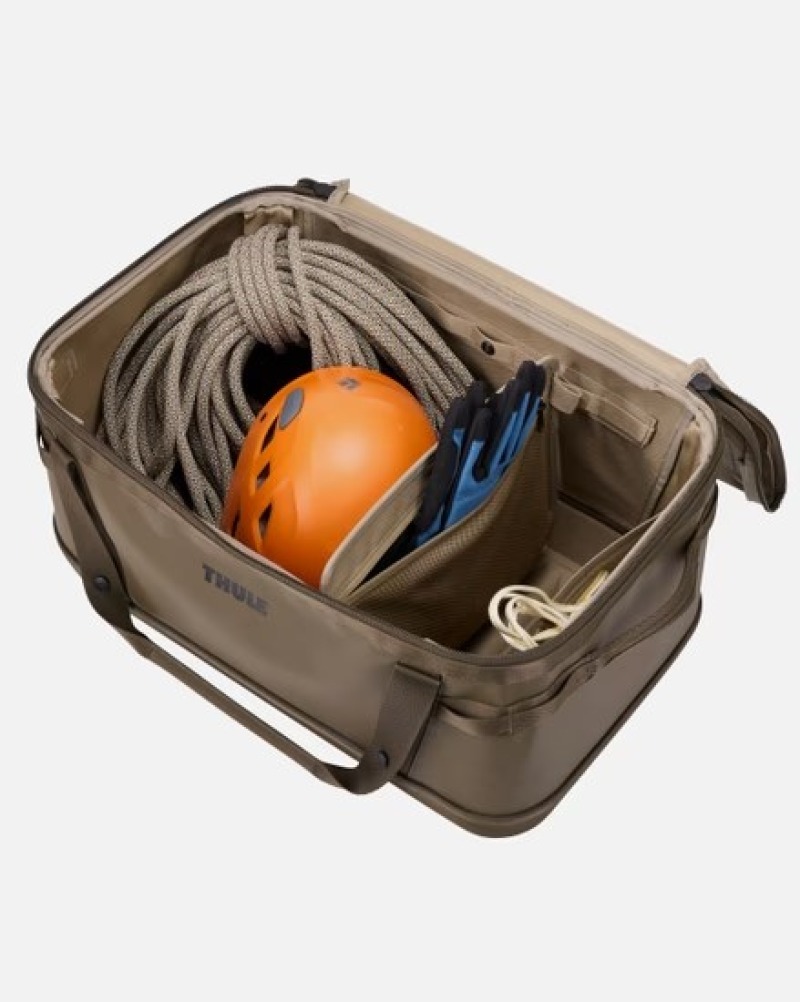 Thule Chasm Gear Hauler 55L Black Open with stuff inside with divider