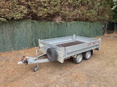 Used 2015 Brian James Cargo Compact 400-0210 flatbed trailer with drop sides and loading ramps