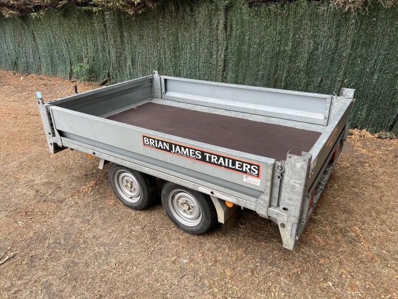 Used 2015 Brian James Cargo Compact 400-0210 flatbed trailer with drop sides and loading ramps
