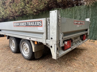 Used 2015 Brian James Cargo Compact 400-0210 flatbed trailer with drop sides and loading ramps