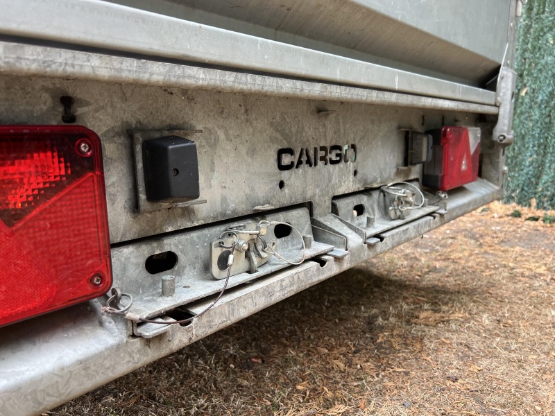 Used 2015 Brian James Cargo Compact 400-0210 flatbed trailer with drop sides and loading ramps