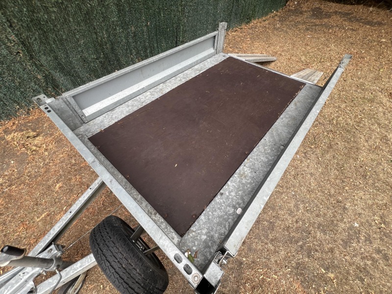Used 2015 Brian James Cargo Compact 400-0210 flatbed trailer with drop sides and loading ramps