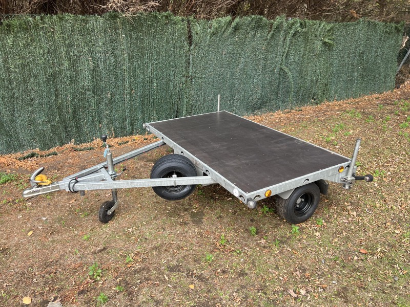 Used Leyland Leisure flatbed motorbike trailer with folding aluminium loading ramps, spare wheel and new tyres