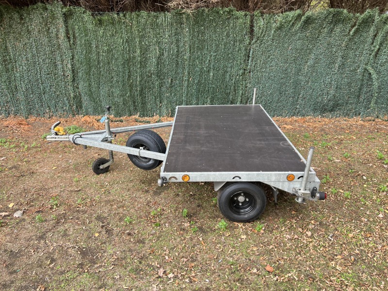 Used Leyland Leisure flatbed motorbike trailer with folding aluminium loading ramps, spare wheel and new tyres