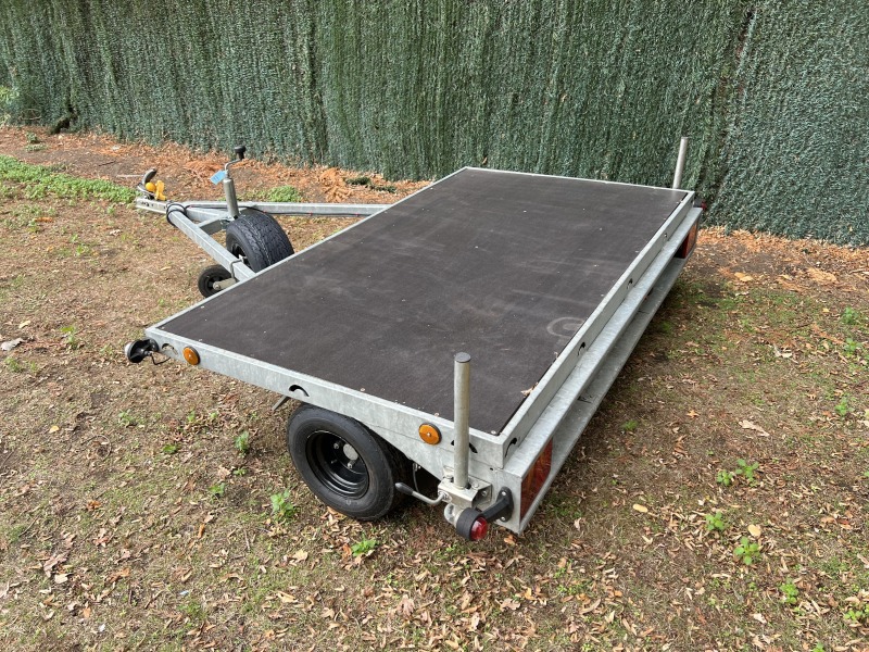Used Leyland Leisure flatbed motorbike trailer with folding aluminium loading ramps, spare wheel and new tyres