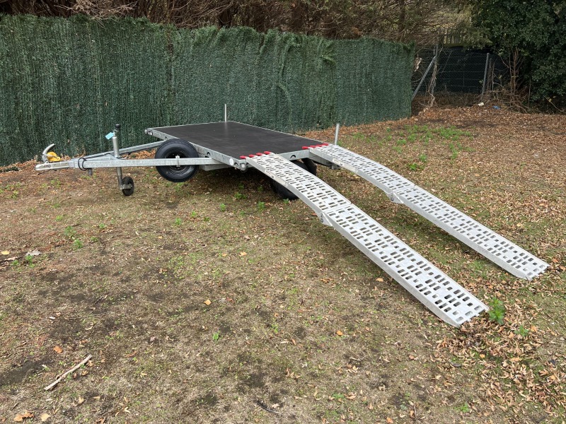 Used Leyland Leisure flatbed motorbike trailer with folding aluminium loading ramps, spare wheel and new tyres