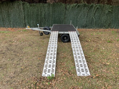 Used Leyland Leisure flatbed motorbike trailer with folding aluminium loading ramps, spare wheel and new tyres