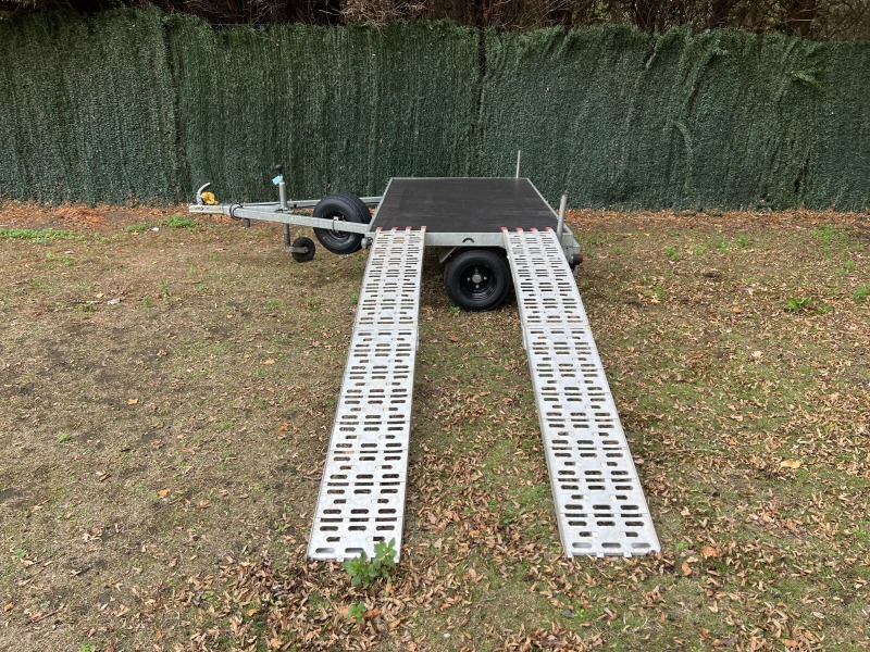Used Leyland Leisure flatbed motorbike trailer with folding aluminium loading ramps, spare wheel and new tyres