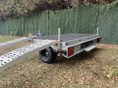 Used Leyland Leisure flatbed motorbike trailer with folding aluminium loading ramps, spare wheel and new tyres
